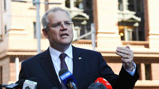Scott Morrison says banks that hide behind the new rules to charge more for loans "have to face their customers." Photo: AAP