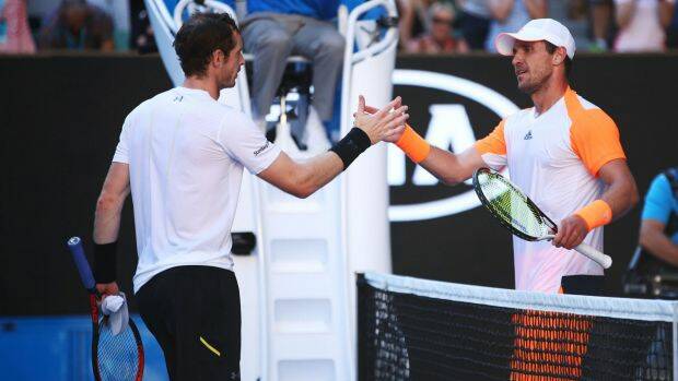 Andy Murray congratulates his conquerer Mischa Zverev. Photo: Getty Images