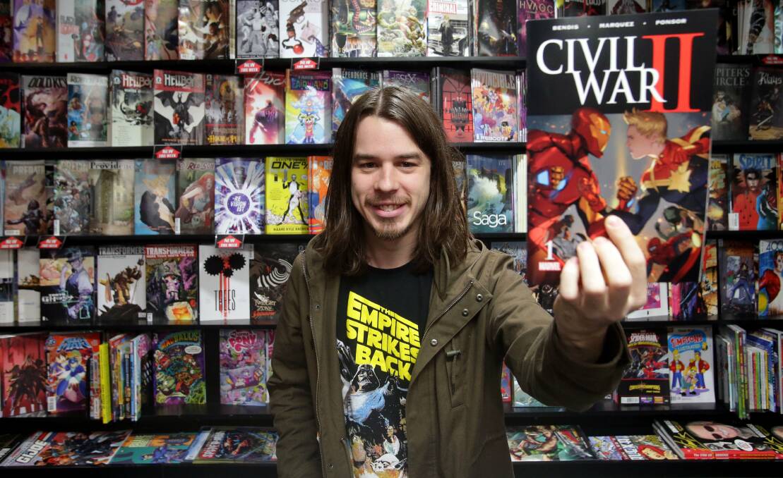 Tom Thorne, from The Comic Shop Liverpool, with some popular comics. Picture: Chris Lane.