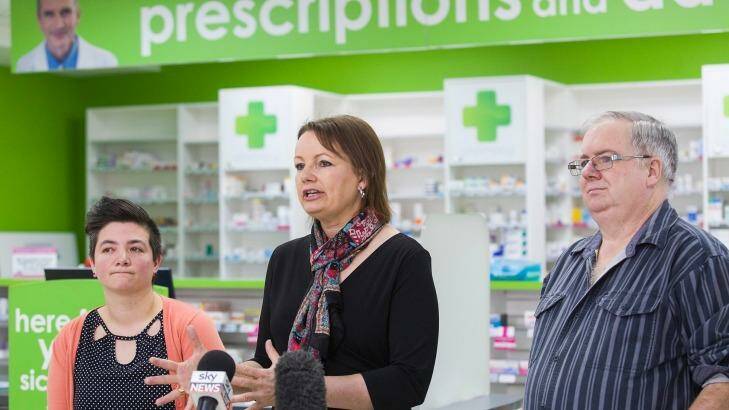 Federal Minister for Health Sussan Ley addresses the media about a new round of medicine price drops which will take effect from October 1. Glen Tilley and Lou Vickers-Willis, pictured, believe they will benefit from the discounts. Photo: Paul Jeffers