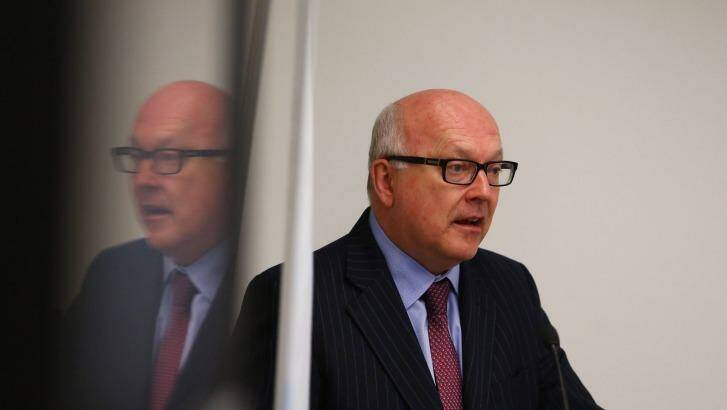 Attorney-General George Brandis (pictured) and Justice Minister Michael Keenan have revealed the new five-tier terror alert system - not expected, possible, probable, expected or certain. Photo: Daniel Munoz