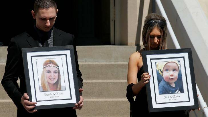Killed in the blast: relatives of Bianka and Jude O'Brien carry their photographs at their funeral. Photo: Daniel Munoz