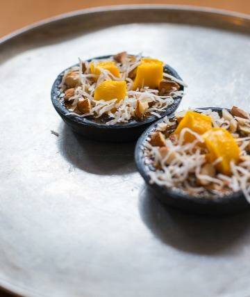 Black sticky rice mango pudding tart with mint and lime-infused custard, almond and coconut. Photo: Sarin Rojanametin