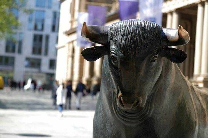 A bull statue stands outside the Frankfurt Stock Exchange in Frankfurt, Germany, on Monday, April 24, 2017. France??????s bonds jumped, with the 10-year yield dropping to its lowest level in three months, after centrist Emmanuel Macron and nationalist Marine Le Pen won the first round of the nation??????s presidential election. Photographer: Krisztian Bocsi/Bloomberg