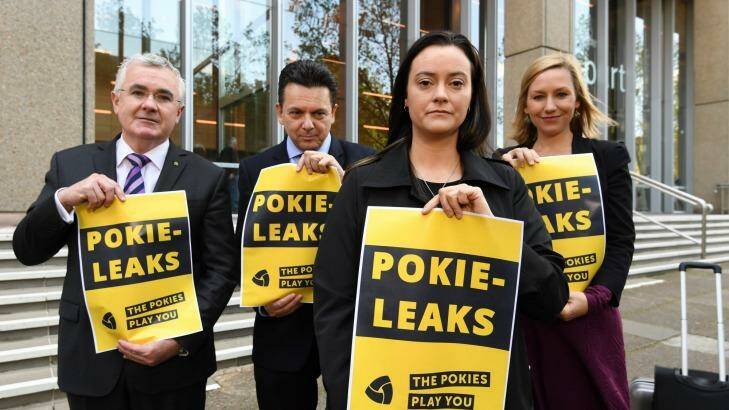 Federal MPs, from left, Andrew Wilkie, Nick Xenophon and Larissa Waters, far right, with former problem gambler Shonica Guy, calling for the release of poker machine industry secrets. Photo: Peter Rae