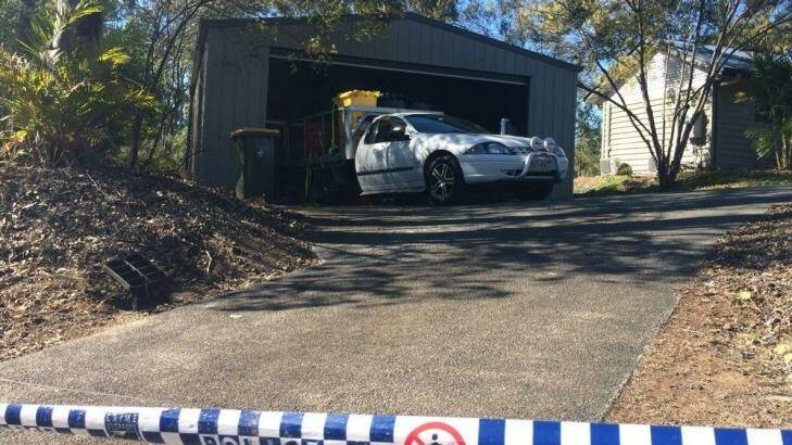 Police remove chemicals from the garage of the Pullenvale home. Photo: Josh Bavas, ABC News