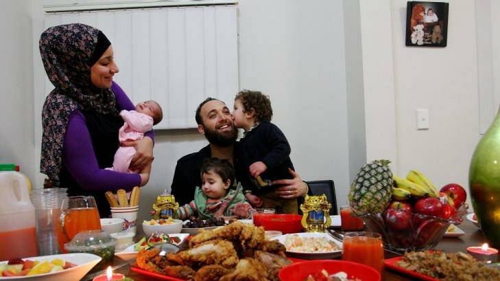 The Saleh family, Ranad, Musher and their children Ayshe, Ahmad (1) and Rimah (2) enjoy a Ramadan feast.