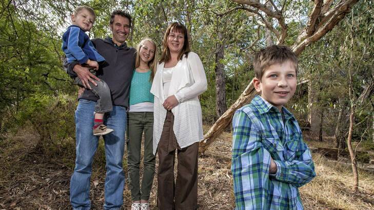 Trust deed: Ryan (front) with his family (from left) Archie, 4, dad Simon Treadwell, Sarah, 11, and mum Kylie Lewin at their home in Eltham. Photo: Luis Ascui