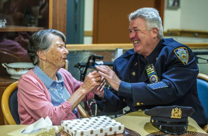 Uniting Care Mirinjani retirement village has granted a lifelong wish for resident Berenice Benson to meet a real New York city cop (something she mentions every tine she gets into the facility lift featuring a poster of the New York skyline). NYPD Detective Howard Shank was glad to accommodate. Photo by Karleen Minney.