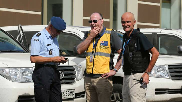Brian McDonald (centre) of the Australian Federal Police contingent with a Dutch colleague (left) and OSCE member (right) in Donetsk. Photo: Kate Geraghty