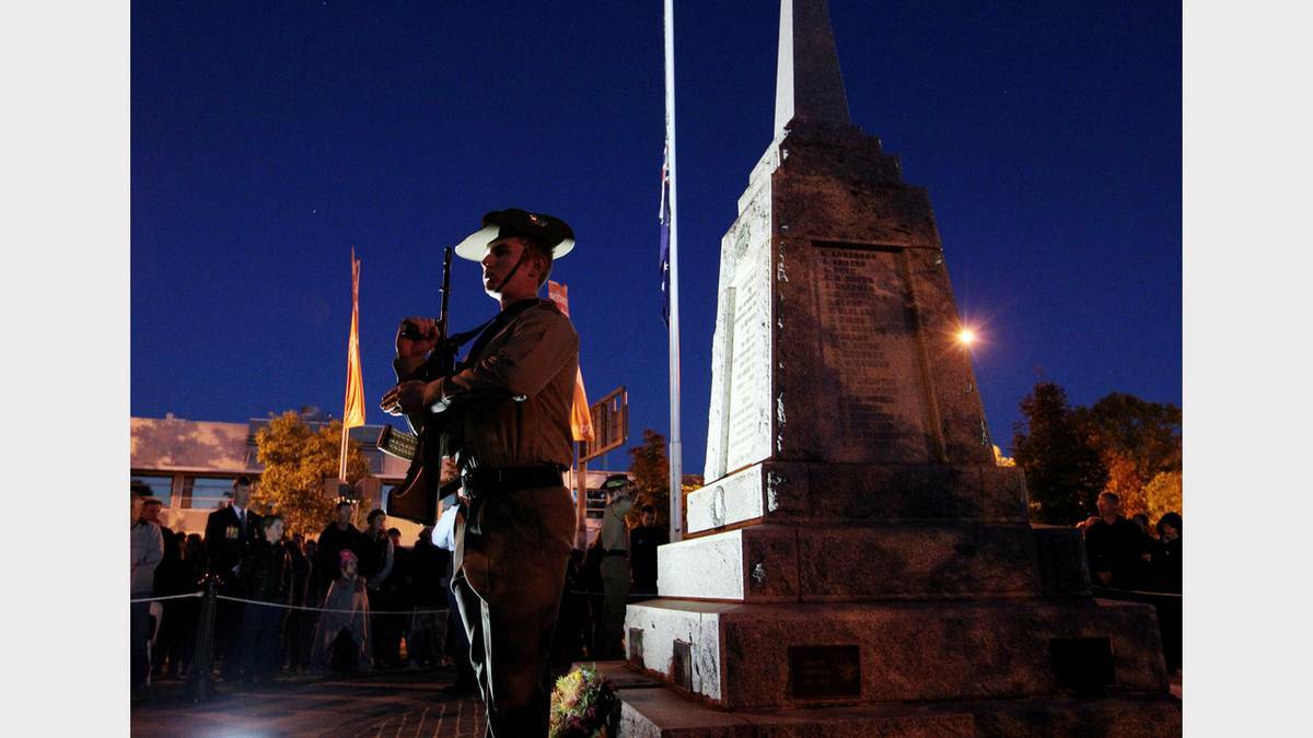 WODONGA: A member of the catafalque party stands guard at the Wodonga dawn service at Woodland Grove. Photos: David Thorpe and John Russell, The Border Mail. 