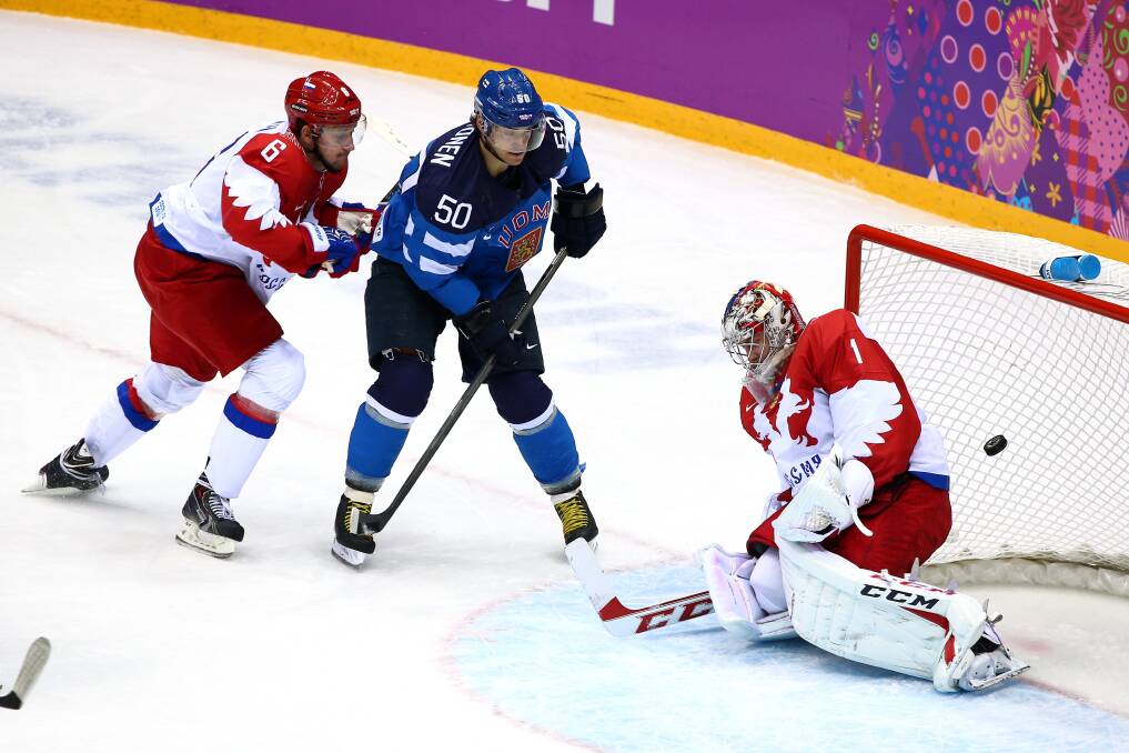 Juhamatti Aaltonen #50 of Finland scores a first-period goal against Semyon Varlamov #1 of Russia as Nikita Nikitin #6 of Russia defends during the Men's Ice Hockey Quarterfinal Playoff on Day 12 of the 2014 Sochi Winter Olympics at Bolshoy Ice Dome on February 19, 2014 in Sochi, Russia. Photo: GETTY IMAGES