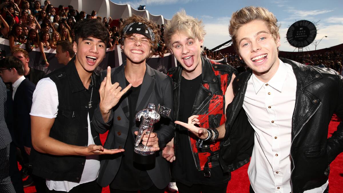 Musicians Calum Hood, Ashton Irwin, Michael Clifford and Luke Hemmings of 5 Seconds of Summer attend the 2014 MTV Video Music Awards. PHOTO: Getty Images