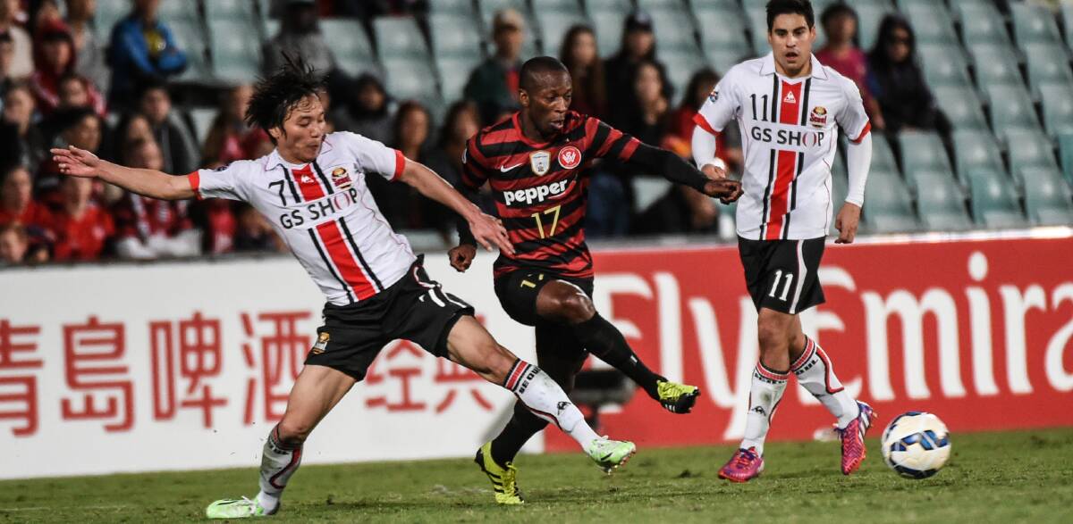 Tough contest: Romeo Castelen was one of the Wanderers' best in their 1-all draw with FC Seoul. Pictures: Brendan Esposito 