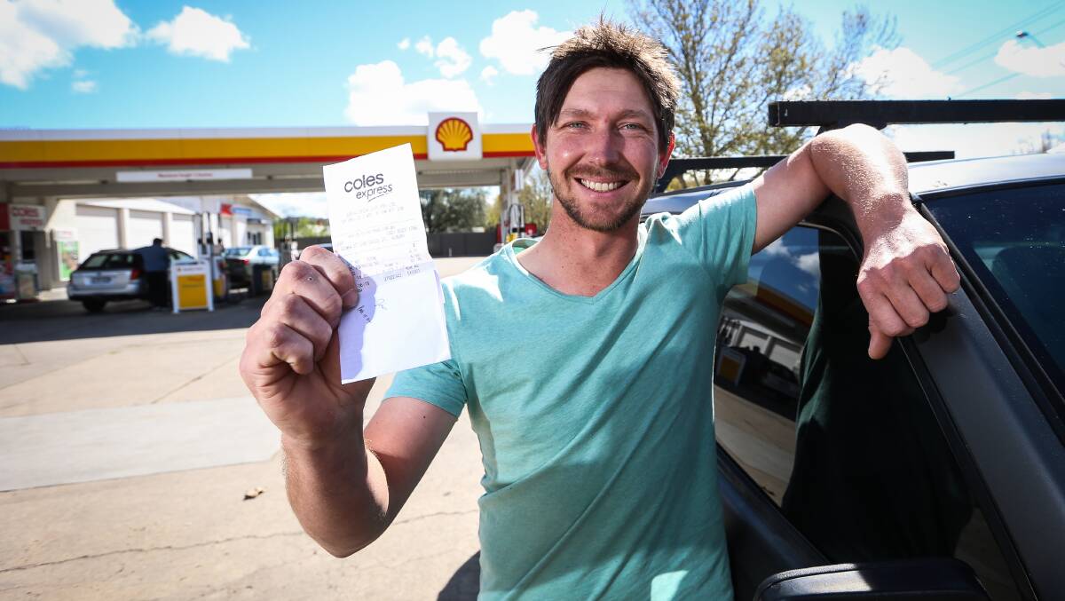PAY IT FORWARD: Tyson Crawley with the receipt paid for by a stranger. He plans to embrace the concept of paying it forward by helping others. Picture: JAMES WILTSHIRE