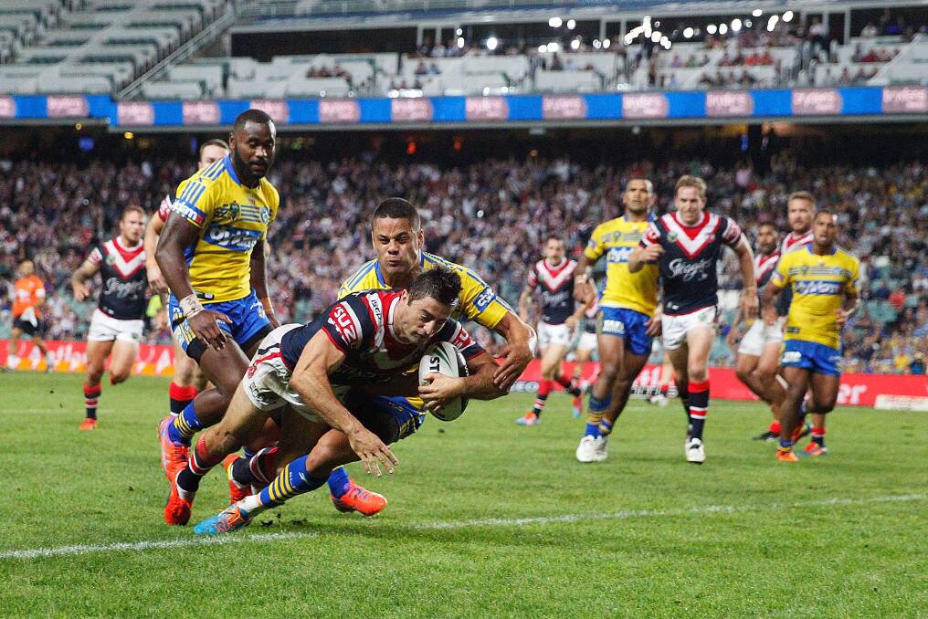 SYDNEY, AUSTRALIA - MARCH 15: Anthony Minichello of the Roosters scores a try during the round two NRL match between the Sydney Roosters and the Parramatta Eels at Allianz Stadium on March 15, 2014 in Sydney, Australia. (Photo by Brendon Thorne/Getty Images)