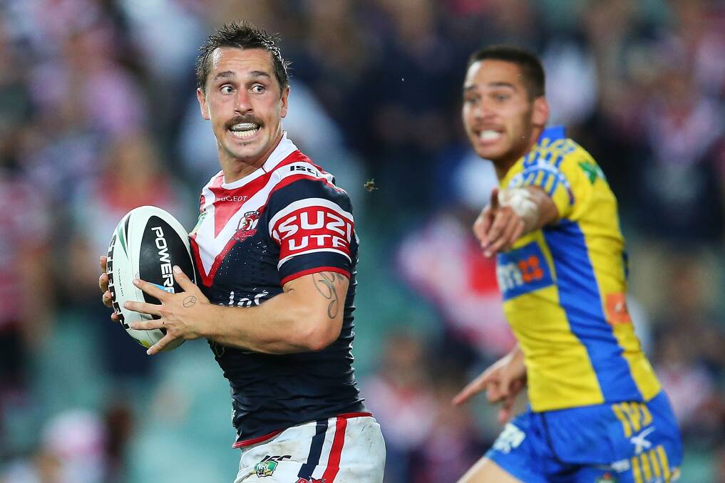 SYDNEY, AUSTRALIA - MARCH 15: Mitchell Pearce of the Roosters runs the ball during the round two NRL match between the Sydney Roosters and the Parramatta Eels at Allianz Stadium on March 15, 2014 in Sydney, Australia. (Photo by Brendon Thorne/Getty Images)